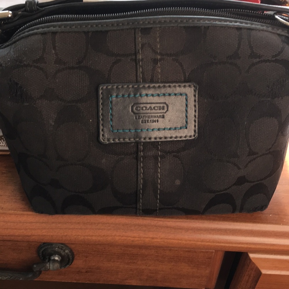 Coach small bag black, with silver hardware.